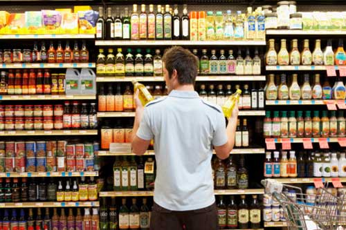 man-reading-food-label