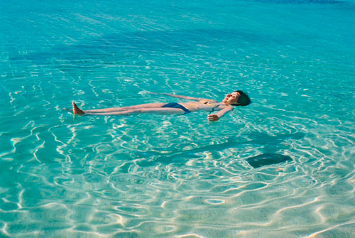 Cuba-Trinidad-Caribbean-Sea-Playa-Ancon-woman-floating-on-clear-water-shadow-1-MY