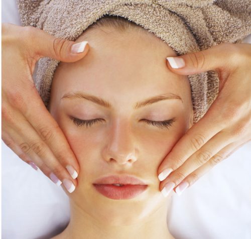 Portrait of a young girl having a massage at a spa resort.