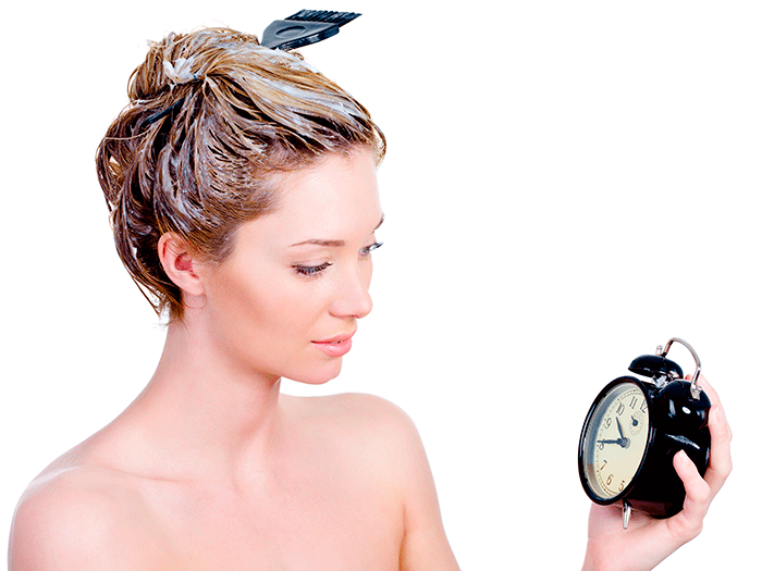 Beautiful Young Woman Coloring Her Hair And Looking At Clock Isolated On White