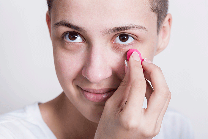 Woman Applying Cream For Dark Circles (1)