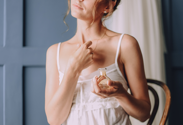 Girl In The Morning Uses Perfume Around Her Neck
