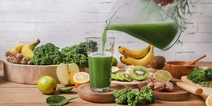 Man Serving Glass Of Green Smoothie Surrounded By Royalty Free Image 1660719063